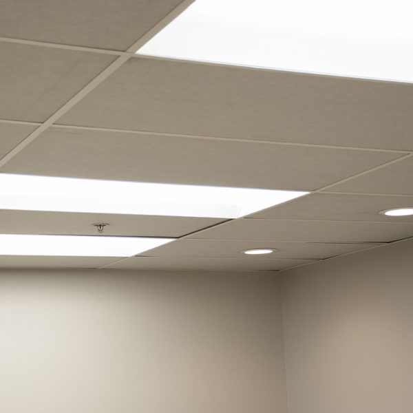 white acoustic ceiling tiles installed in an office