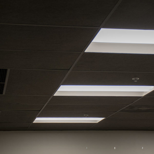 Black acoustic ceiling tiles installed